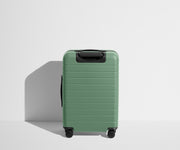 Back product view of The Bigger Carry-On suitcase in Sea Green