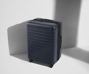Angled product view of The Medium Flex suitcase in Navy Blue