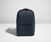 Backpack in Navy with one small pocket in the front.