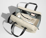 A pair of keys attached to the key leash in the main compartment