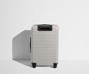 Back product view of The Bigger Carry-On suitcase in Cloud Gray