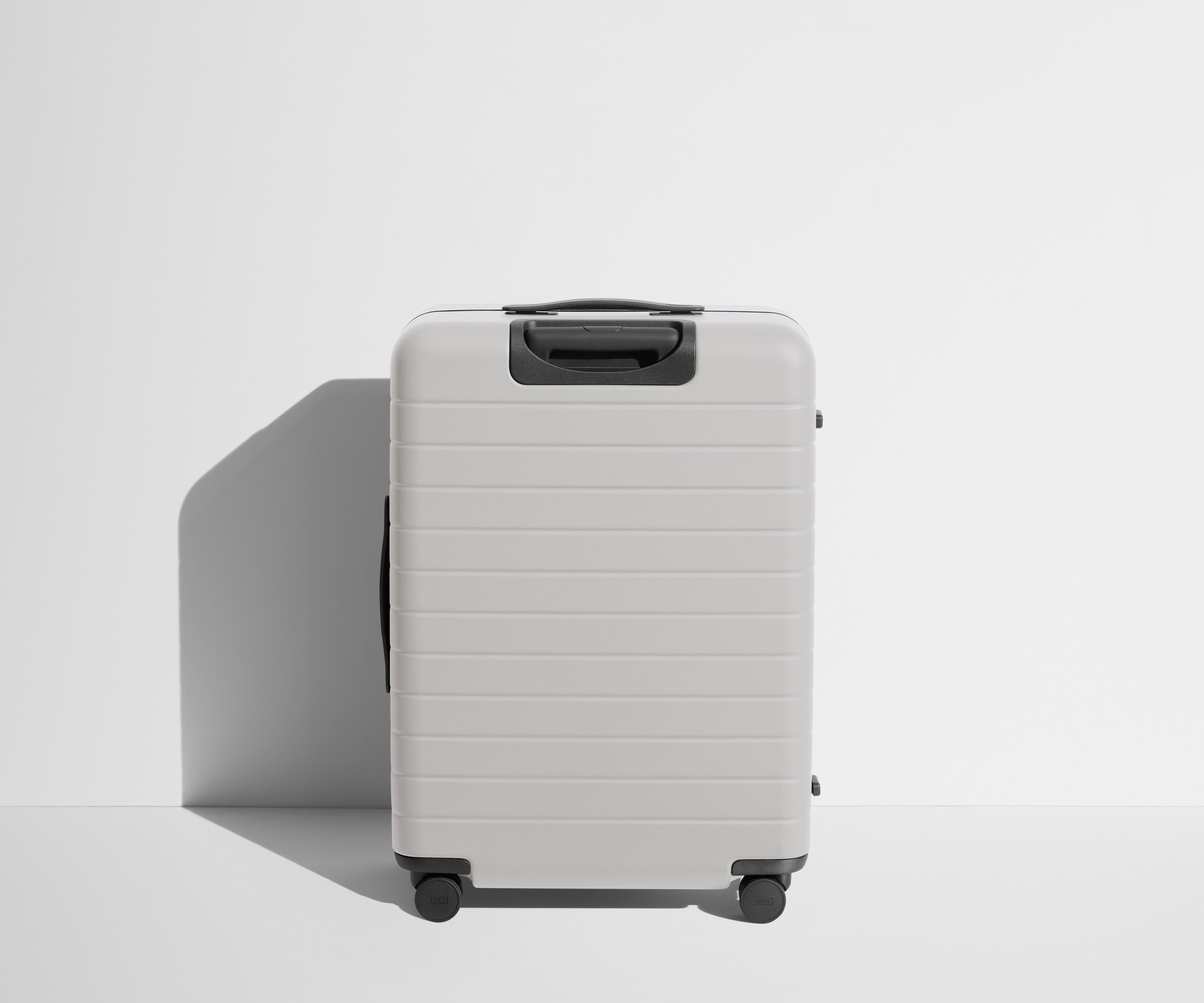 Back product view of The Medium Flex suitcase in Cloud Gray